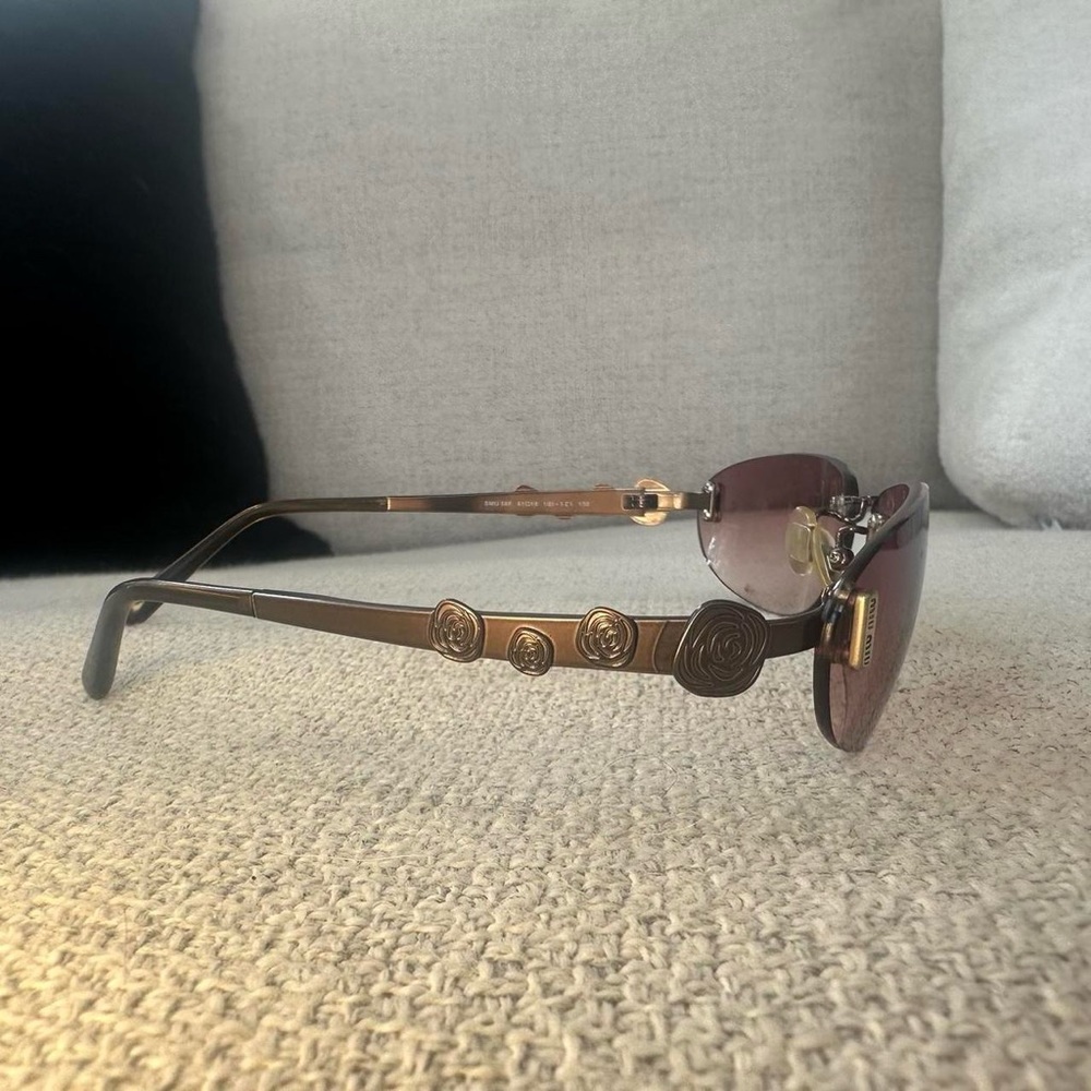 vintage Miu Miu pink sunglasses with rose detailing